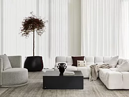 Blinde Design Bloc 40 concrete coffee table grounds a private residence living room with a minimalist modern centrepiece.