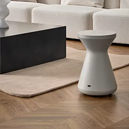 Blinde Design Solo Stool adds bone concrete seating to a private residence living room, delivering modern designer furniture flair.